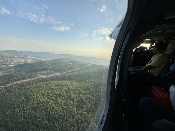 Bodrum'da kontrol altına alınan orman yangınında soğutma çalışmaları havadan görüntülendi